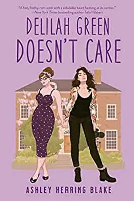 Delilah Green Doesn't Care by Ashley Herring Blake book cover with house and two people - one in a dress and one in a black jumper - in front of it on purple background
