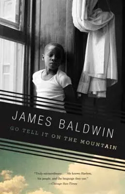 Go Tell It On The Mountain by James Baldwin book cover with black and white image of young child standing near a window