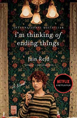 I'm Thinking of Ending Things by Iain Reid book cover with person with fair skin and red hair with old fashioned flowery wallpaper and chandelier
