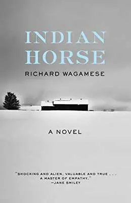 Indian Horse by Richard Wagamese book cover with building in the distance in the snow with one tree and gray sky