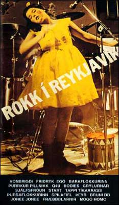 Rokk i Reykjavik Rock in Reykjavik Movie with woman in yellow dress in front of drums