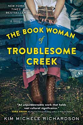 The Book Woman of Troublesome Creek by Kim Michele Richardson book cover with brown shoes and red and white garnet over person's knees 