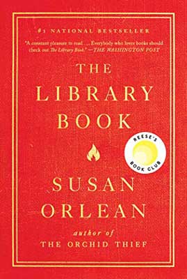 The Library Book by Susan Orlean book cover with tiny yellow flame in center on red background