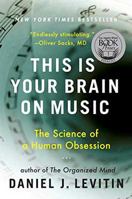 This Is Your Brain On Music by Daniel J. Levitin book cover with rolled page of music notes