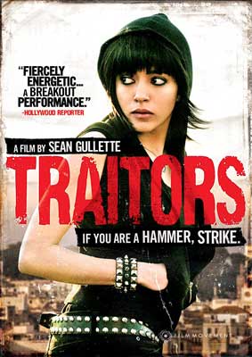 Traitors Movie Poster with image of person with shoulder length black hair and wearing black looking behind them