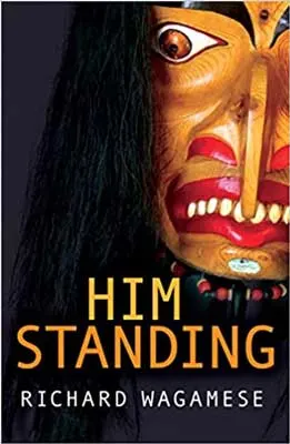 Him Standing by Richard Wagamese book cover with mask like face with red lips and pointed teeth and nose