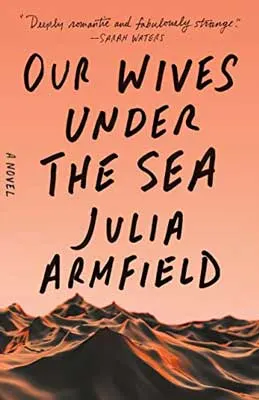 Our Wives Under the Sea by Julia Armfield book cover with mountain range and orange sky