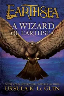 A Wizard of Earthsea by Ursula K. Le Guin book cover with large brown bird of prey with wide open wings and purple background