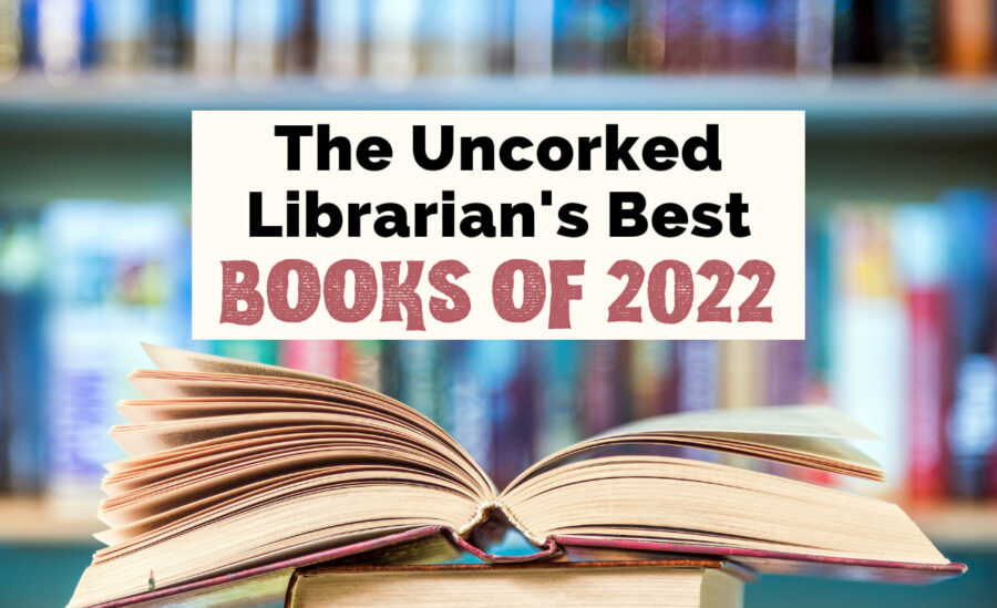 Best Books of 2022 with image of open book in front of blurred bookshelf covered with books