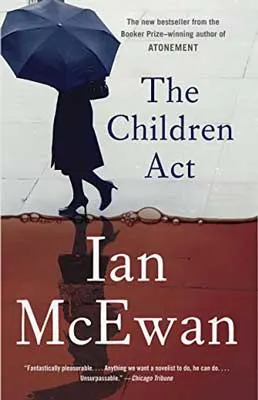 The Children Act by Ian McEwan book cover with person with umbrella walking on bloody like water