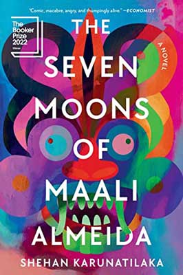 The Seven Moons of Maali Almeida by Shehan Karunatilaka book cover with orange, yellow, green, pink, and blue fantastical face with green teeth