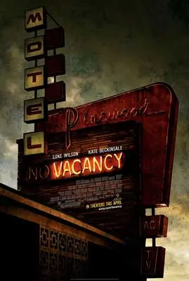Vacancy Movie Poster with image of motel sign with vacancy light on and dark cloudy sky