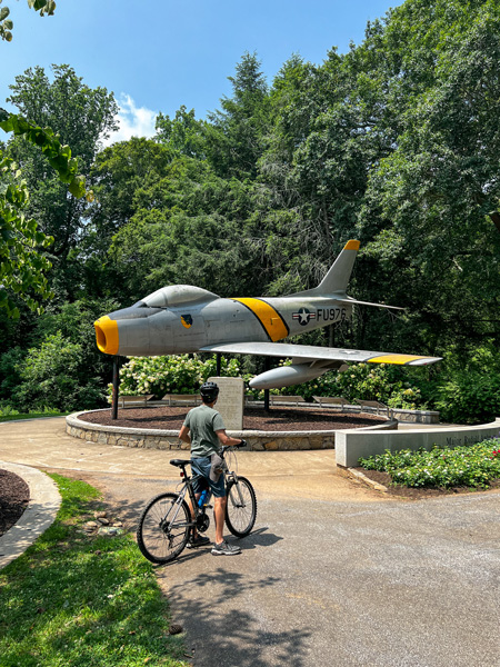 Tom with F 86 Sabre plane memorial in Cleveland Park