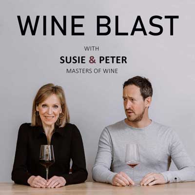 Wine Blast with Susie and Peter Podcast cover with white blonde woman and brunette blonde male sitting with glasses on wine in front of them