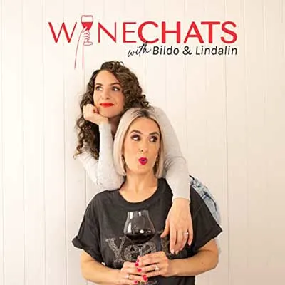 Wine Chats with Bildo and Lindalin Podcast cover with two woman, one holding glass of red wine and the other behind her with arm over her shoulder and chin resting on hand