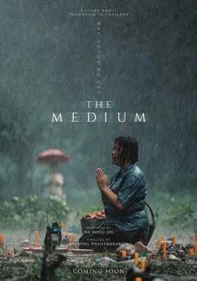 The Medium Movie Poster with person kneeling on ground in rain praying