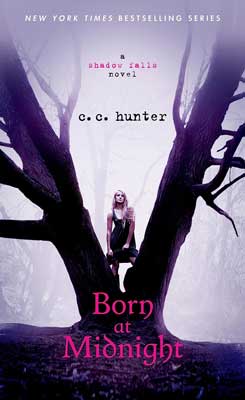 Born At Midnight by C.C. Hunter book cover with image of tree with person standing between two large branches spilt from trunk