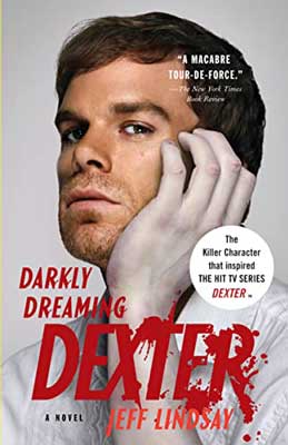 Darkly Dreaming Dexter by Jeff Lindsay with brunette male's face with white hand stroking it