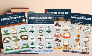 Article featured image showcasing the Uncorked 2024 Reading Challenge with all four bingo cards with cute icons and themes over each icon along with blurred background of stacked books with tan wall