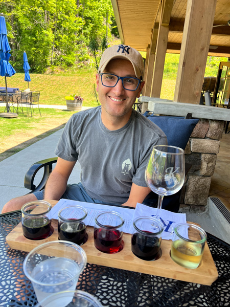 Tom with wine flight at Kennington Family Winery