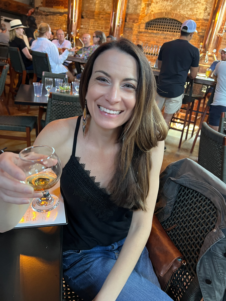 Christine with beer at New Realm Brewing Co.