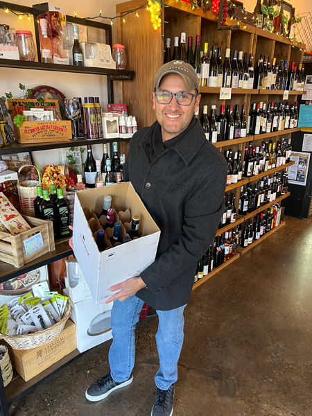 Tom buying wine at Maggie B's